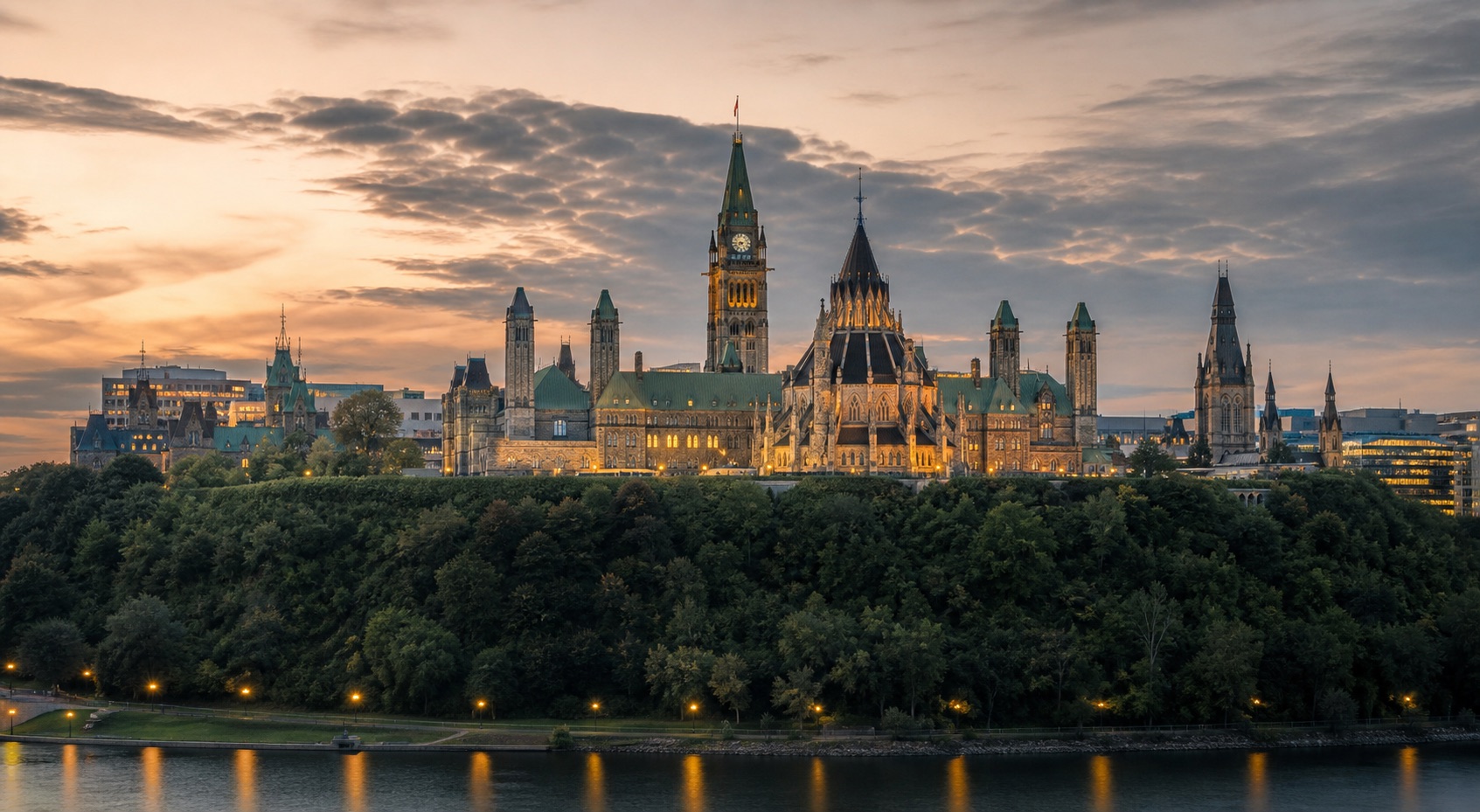Ottawa Parliament buildings at dusk above the river